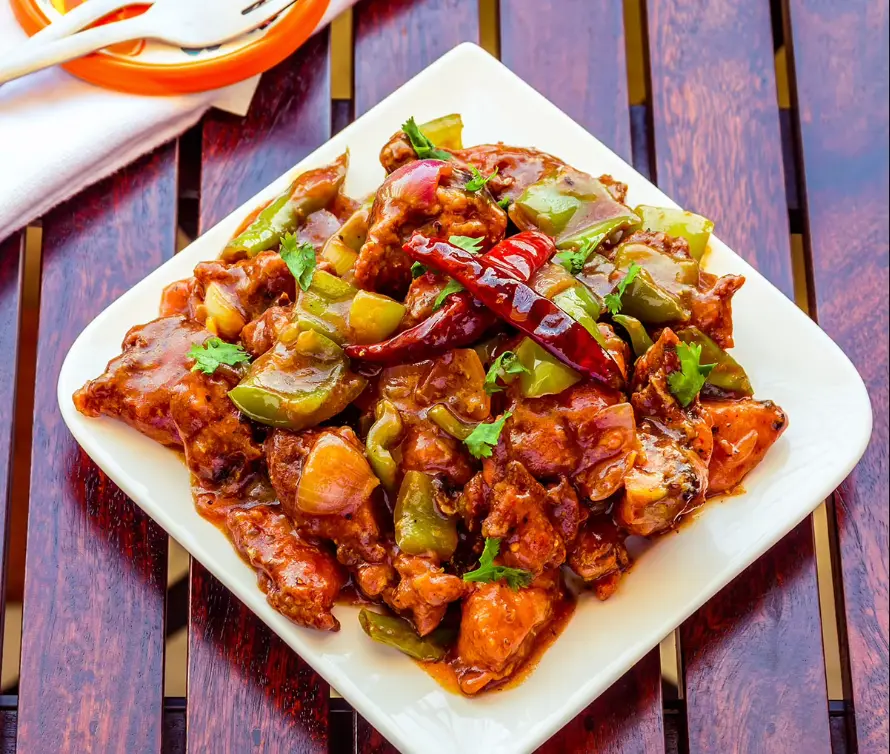 Chicken Chilly from Himalayan Spice Austin TX – fried chicken tossed with chili sauce and bell peppers powered by Skiplyn